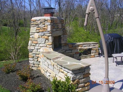 stone fireplace and stamped concrete / Anderson