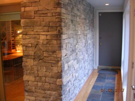 Dry stack wine cellar / Amberly Village